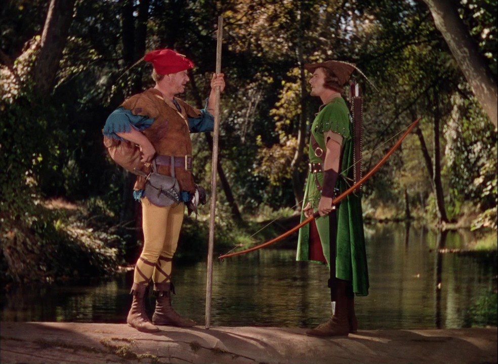 Robin des bois et Petit Jean avant leur duel au bâton au dessus de la rivière dans le film de Michael Curtiz (1938)